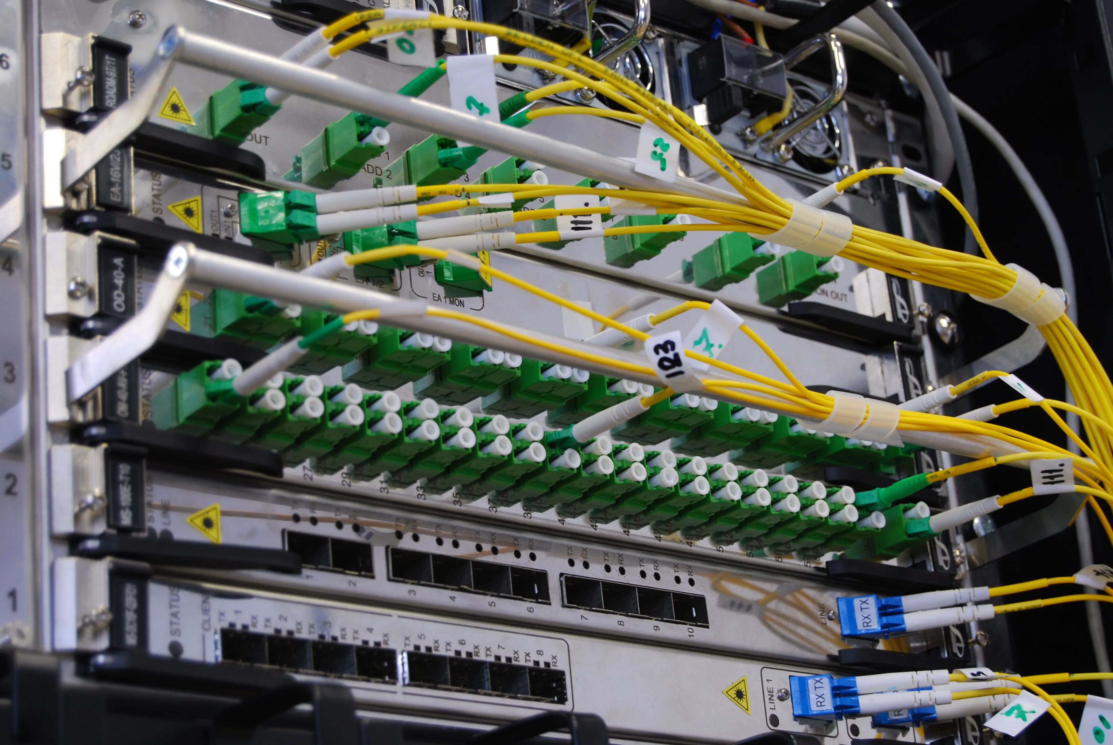 Routers and Patch Panels in a telecommunications rack.